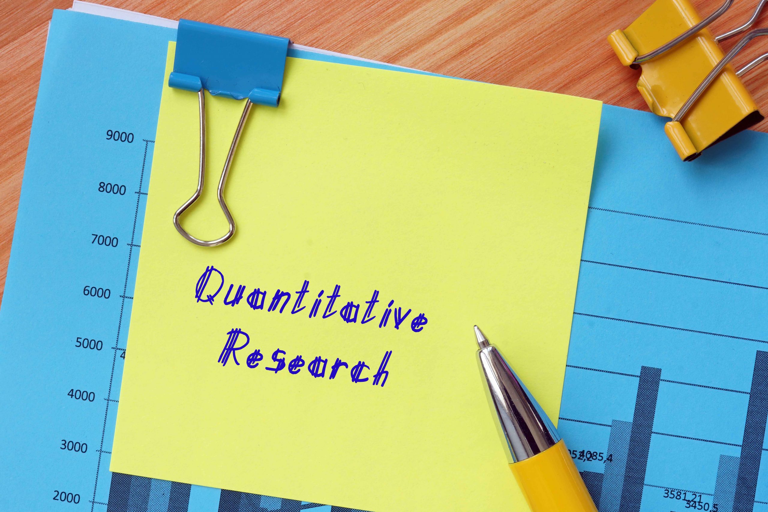 concept about Quantitative Research with phrase on the sheet.