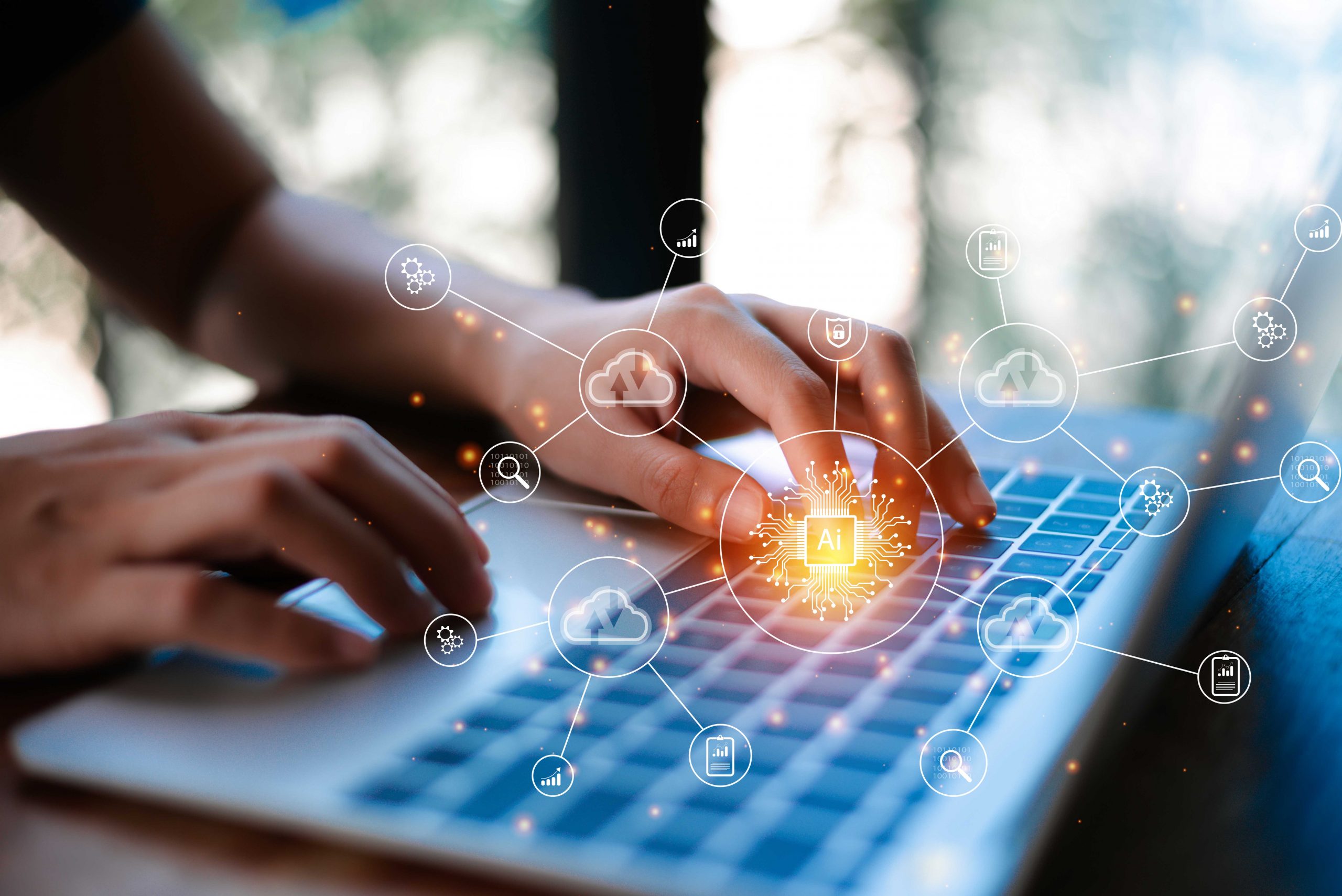 Person typing on laptop with icons to illustrate artificial intelligence.
