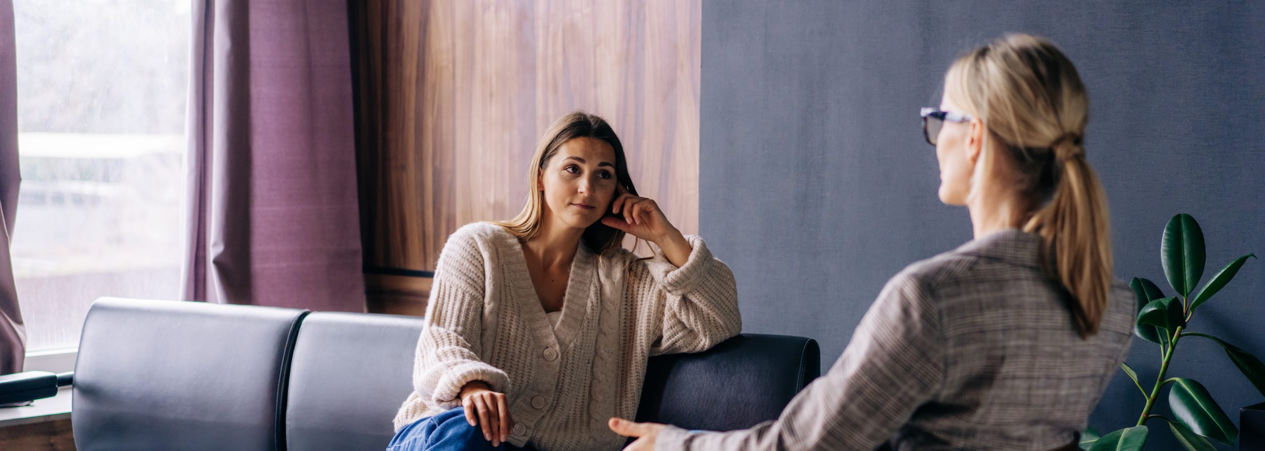 A young woman in a consultation with a psychologist.