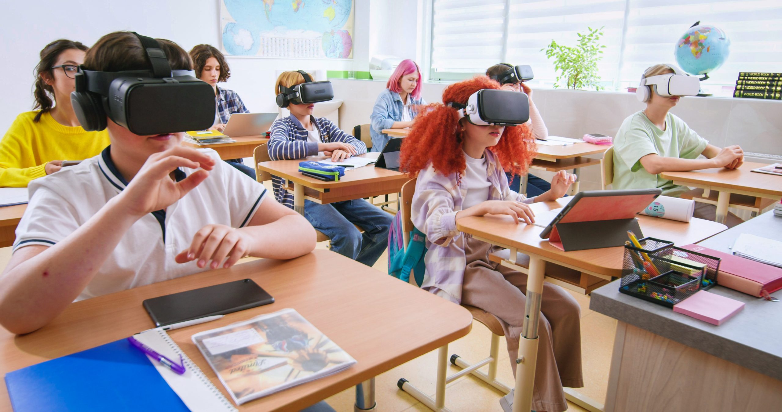 Students wear virtual reality headsets inside a classroom.