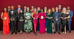 2026 18 Under 31 Young Alumni Award winners pose for a photo together following the award reception.